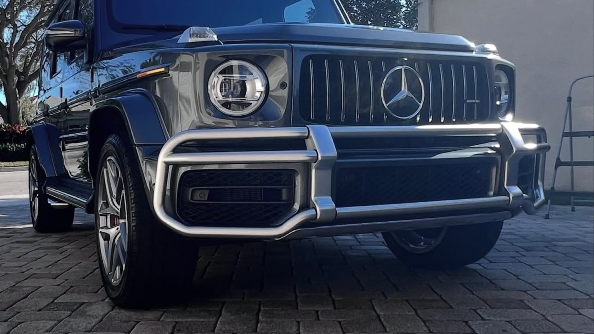Grey Mercedes-AMG G-Class, front view in a driveway