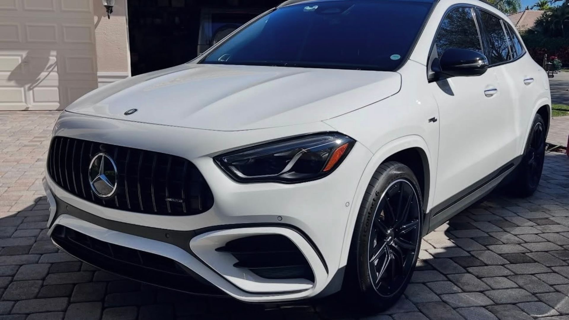 White Mercedes-AMG SUV with a Panamericana grille